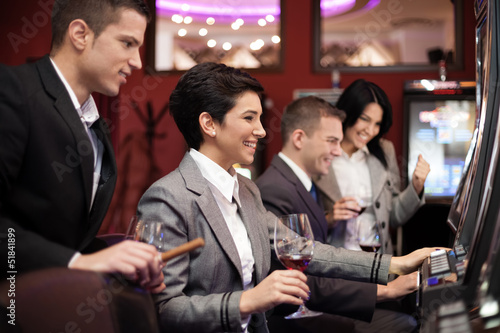 Photo: Young people gambling on slot machines Young people gambling on slot machines