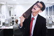 Photo: Frustrated businessman cutting his neck Frustrated businessman cutting his neck