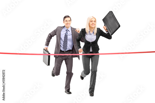 Photo: Full length portrait of a businesspeople running towards a finis Full length portrait of a businesspeople running towards a finis
