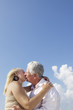 Photo: Active retired people, romantic elderly couple in love and kissi Active retired people, romantic elderly couple in love and kissi