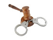 Gavel and handcuffs isolated on white