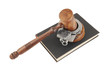 Judge's gavel and handcuffs on black legal book isolated