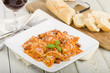 Ravioli filled with chicken & chorizo. Tomato & chorizo sauce.
