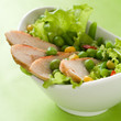Chicken salad with lettuce, peas and corn, selective focus