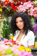 Female florist working in a greenhouse