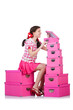 Young woman with storage boxes on white