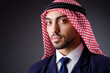 Arab businessman in dark studio