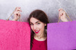 Glad woman with two paper bags