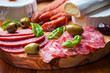 Photo: Salami catering platter with different meat and cheese products Salami catering platter with different meat and cheese products