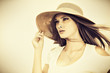 holding hat