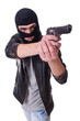 Young thug with gun isolated on white