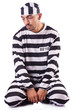 Inmate in stiped uniform on white