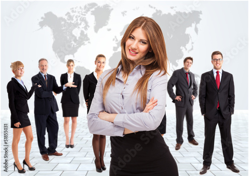 Photo: Businesswoman in front of her team Businesswoman in front of her team