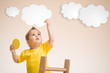 Photo: Kid holding cloud in hand Kid holding cloud in hand