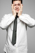 Businessman in white shirt expressing problems.