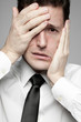 Businessman in white shirt expressing problems.