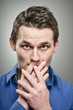 Caucasian Man Covering Mouth With Hands Portrait