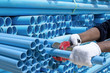 Worker cut pvc pipe in construction site