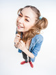 cute funny girl with two pony tails smiling - wide angle shot