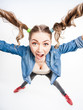 cute funny girl with two pony tails smiling - wide angle shot