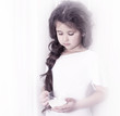 beautiful little girl with a cup of milk. close-up