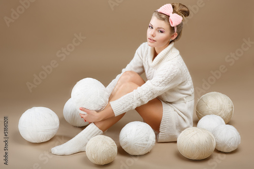 Photo: Crochet. Needlewoman with White Skeins of Yarn. Needlecraft Crochet. Needlewoman with White Skeins of Yarn. Needlecraft