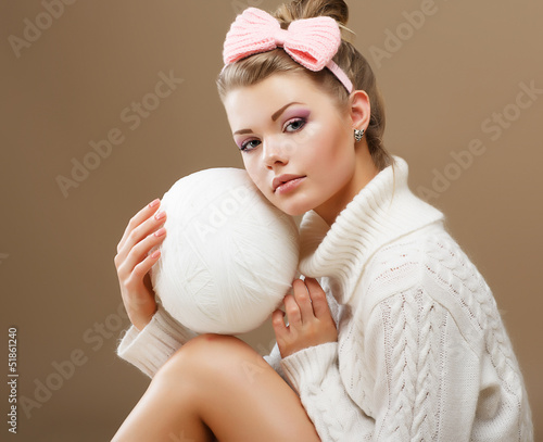 Photo: Hosiery. Teen in Handmade Woven Sweater with White Ball of Yarn Hosiery. Teen in Handmade Woven Sweater with White Ball of Yarn