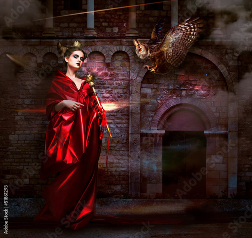 Photo: Magic. Witchcraft. Sorcerer with Vulture Hawk. Ancient Castle Magic. Witchcraft. Sorcerer with Vulture Hawk. Ancient Castle