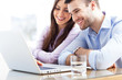Business couple using laptop