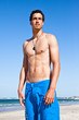 Handsome fit young man on the beach