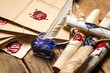 Closeup of ancient scrolls and old envelope with blue inkwell