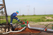 oilfield with worker and pipeline