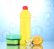 Dishwashing liquid with sponges and lemon with flowers