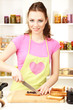 Young woman cooking in kitchen