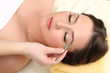 Beautiful young woman in cosmetic salon close up