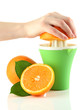 Preparing fresh orange juice squeezed with hand juicer,