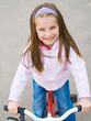 Photo: little girl with her bicycle little girl with her bicycle