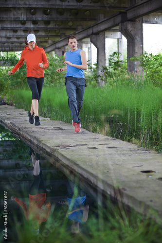 Photo: man and woman running training man and woman running training