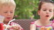 Children Enjoying Food At Party