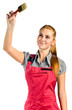 Young woman in red overalls with brush