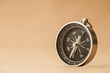 Compass on Light Brown Background