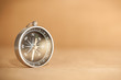 Compass on Light Brown Background