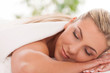 Beautiful woman lying in a spa