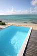 Beautiful view of infinity pool with wooden deck