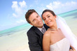 Just married couple standing on a paradisiacal beach