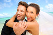 Just married couple standing on a paradisiacal beach