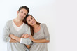 Young Couple Standing On White...