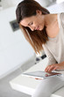 Foto: Young cheerful woman using electronic tablet Young cheerful woman using electronic tablet