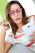 Girl with pink eyeglasses connected on internet
