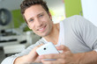 Photo: Man relaxing in sofa and reading his emails Man relaxing in sofa and reading his emails